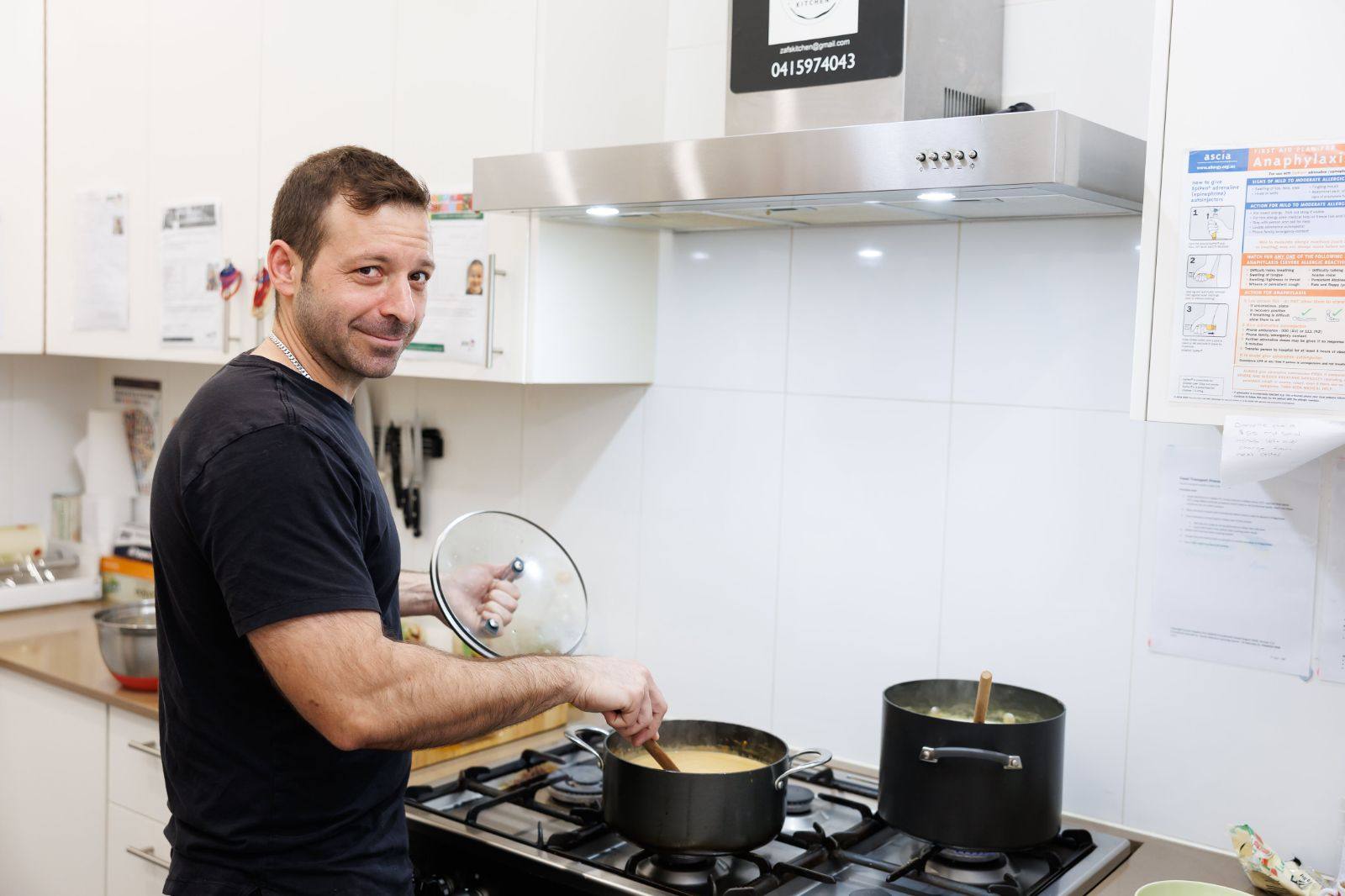 Mr Chris cooking in the centre kitchen