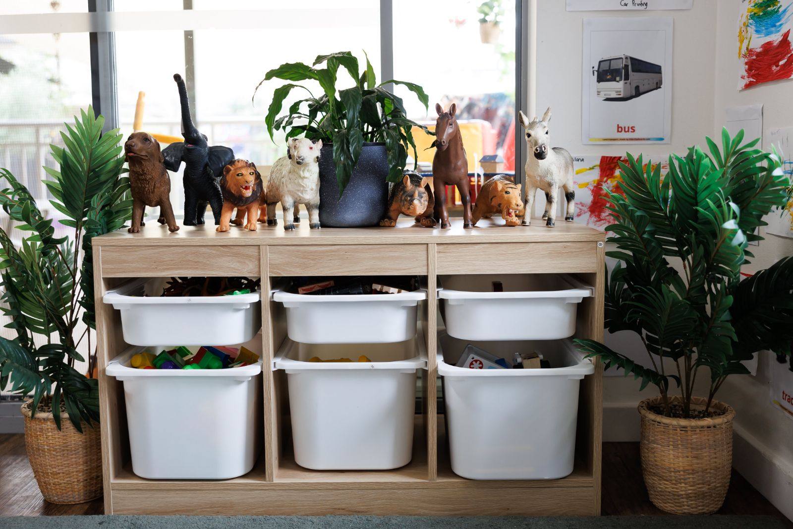 Toy animals on a wooden shelf