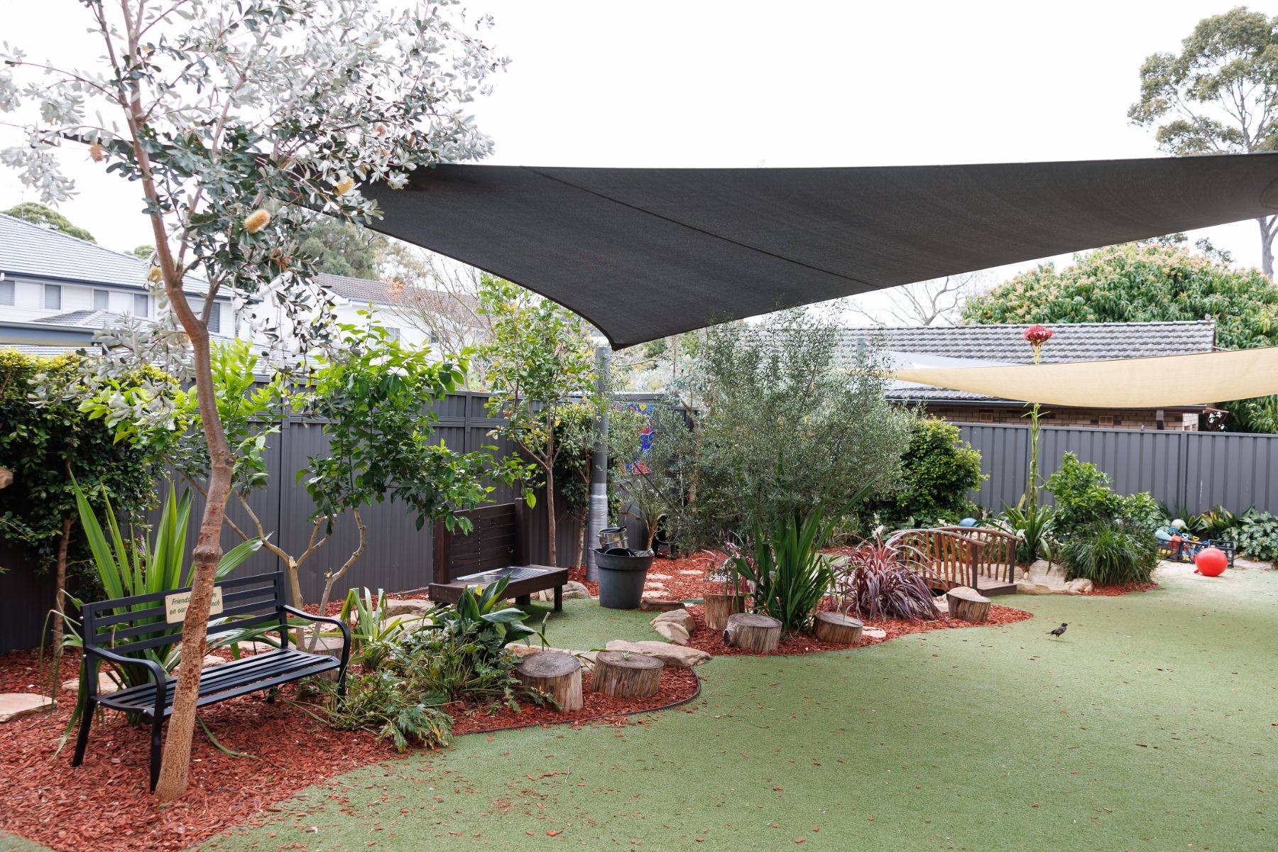 Play yard with shade sails